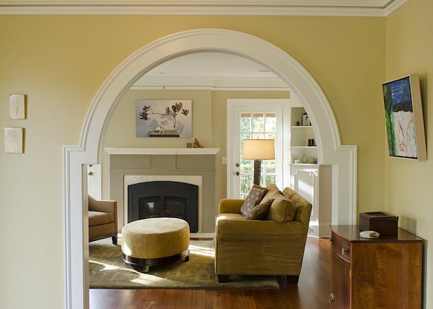 Exquisite finish work, moulding, archway framing, fireplace and french doors, hardwood floors
